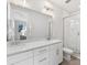 Bright bathroom with double vanity, marble countertop, large mirror and glass enclosed shower at 8005 Elevate Ct, Charlotte, NC 28205