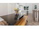 Bright dining area features modern table with bench seating and stylish chandelier at 8005 Elevate Ct, Charlotte, NC 28205