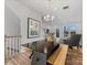 Bright dining area features modern table with bench seating and stylish chandelier at 8005 Elevate Ct, Charlotte, NC 28205