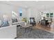 Bright living area with an open floor plan and seamless flow to the dining area at 8005 Elevate Ct, Charlotte, NC 28205