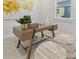 Bright home office with modern desk, stylish poufs, and a large abstract painting at 8005 Elevate Ct, Charlotte, NC 28205