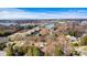 Aerial view of lakefront community with tennis courts and pool at 116 Diamond Head Dr, Mooresville, NC 28117