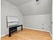 Simple bedroom with hardwood floors and wall-mounted TV at 116 Diamond Head Dr, Mooresville, NC 28117