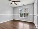 Bright bedroom with hardwood floors and window views at 116 Diamond Head Dr, Mooresville, NC 28117