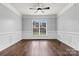 Bright dining room with hardwood floors and wainscoting at 116 Diamond Head Dr, Mooresville, NC 28117