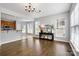 Bright dining room with hardwood floors and kitchen view at 116 Diamond Head Dr, Mooresville, NC 28117