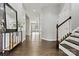 Elegant entryway with dark hardwood floors and staircase at 116 Diamond Head Dr, Mooresville, NC 28117