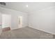 Carpeted bedroom with adjacent bathroom; providing a comfortable and private space at 1531 Harper Landing Blvd, Stanley, NC 28164