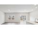 Bright living room with recessed lighting, sliding glass doors to outside, and hardwood style flooring at 1531 Harper Landing Blvd, Stanley, NC 28164