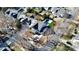 Aerial view of a house and neighborhood with lush trees at 19935 Wooden Tee Dr, Davidson, NC 28036