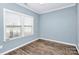 Cozy bedroom with wood floors and window blinds at 19935 Wooden Tee Dr, Davidson, NC 28036