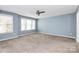 Spacious bedroom with ceiling fan and neutral carpet at 19935 Wooden Tee Dr, Davidson, NC 28036