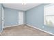 Simple bedroom with light blue walls and neutral carpet at 19935 Wooden Tee Dr, Davidson, NC 28036