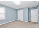 Bedroom with double doors to closet and neutral carpet at 19935 Wooden Tee Dr, Davidson, NC 28036