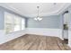 Bright dining room with wainscoting and chandelier at 19935 Wooden Tee Dr, Davidson, NC 28036