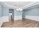 Formal dining room with hardwood floors and chandelier at 19935 Wooden Tee Dr, Davidson, NC 28036