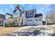 Two-story house with blue siding and two-car garage at 19935 Wooden Tee Dr, Davidson, NC 28036