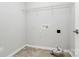 Laundry room with shelving and linoleum flooring at 19935 Wooden Tee Dr, Davidson, NC 28036