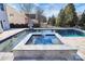 Relaxing spa and pool with grey tile at 19935 Wooden Tee Dr, Davidson, NC 28036