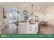 Open concept kitchen with island, dining area, and living room at 2017 South St, Charlotte, NC 28208