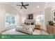 Spacious primary bedroom with ample natural light and ceiling fan at 2017 South St, Charlotte, NC 28208