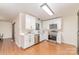 This kitchen features white cabinets, stainless steel appliances, and light countertops at 2030 Manila Bay Ln # 30, Tega Cay, SC 29708