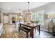 Kitchen dining area with wooden table and bench seating at 226 Hickory St, Locust, NC 28097