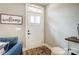 Inviting entryway with white door and hardwood floors at 226 Hickory St, Locust, NC 28097