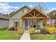 Charming craftsman style home with front porch and landscaping at 226 Hickory St, Locust, NC 28097