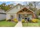 Charming craftsman style home with front porch and landscaped yard at 226 Hickory St, Locust, NC 28097