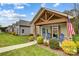 Quaint community of craftsman style homes with lush lawns at 226 Hickory St, Locust, NC 28097