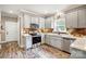 Well-appointed kitchen featuring granite countertops and shaker cabinets at 226 Hickory St, Locust, NC 28097