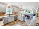 Open concept kitchen with island and view into living room at 226 Hickory St, Locust, NC 28097