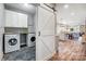 Laundry room with washer, dryer, and built-in cabinets at 226 Hickory St, Locust, NC 28097