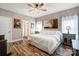 Main bedroom with king bed and ceiling fan at 226 Hickory St, Locust, NC 28097