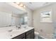 Clean bathroom with double sinks and a large mirror at 3960 Farmington Ridge Pkwy, Charlotte, NC 28213