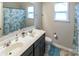 Bathroom with a double vanity and shower/tub combo at 3960 Farmington Ridge Pkwy, Charlotte, NC 28213