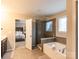 Modern bathroom with a large shower and soaking tub at 3960 Farmington Ridge Pkwy, Charlotte, NC 28213