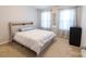 Bedroom with a queen-size bed and neutral decor at 3960 Farmington Ridge Pkwy, Charlotte, NC 28213