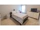 Bedroom with a full-size bed, dresser, and TV at 3960 Farmington Ridge Pkwy, Charlotte, NC 28213