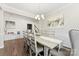 Bright dining room featuring a farmhouse table and chandelier at 3960 Farmington Ridge Pkwy, Charlotte, NC 28213