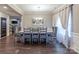 Elegant dining room featuring a large table and gray upholstered chairs at 3960 Farmington Ridge Pkwy, Charlotte, NC 28213