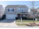 Two-story house with attached garage and front yard at 3960 Farmington Ridge Pkwy, Charlotte, NC 28213