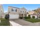 Two-story house with a neutral exterior, two-car garage, and basketball hoop at 3960 Farmington Ridge Pkwy, Charlotte, NC 28213