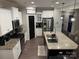 Modern kitchen with stainless steel appliances and granite countertops at 3960 Farmington Ridge Pkwy, Charlotte, NC 28213