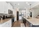 Open concept kitchen with white cabinets and granite at 3960 Farmington Ridge Pkwy, Charlotte, NC 28213