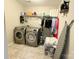 Laundry room with washer, dryer, and storage shelving at 3960 Farmington Ridge Pkwy, Charlotte, NC 28213