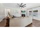 Cozy living room with a fireplace, sectional sofa, and hardwood floors at 3960 Farmington Ridge Pkwy, Charlotte, NC 28213