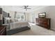 Main bedroom with king-size bed and large dresser at 3960 Farmington Ridge Pkwy, Charlotte, NC 28213