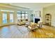 Bright and airy living room with hardwood floors, large windows, and a fireplace at 409 Newstyle Way # 3, Cramerton, NC 28056